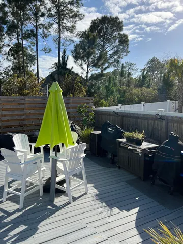 a view of backyard with seating space and trees