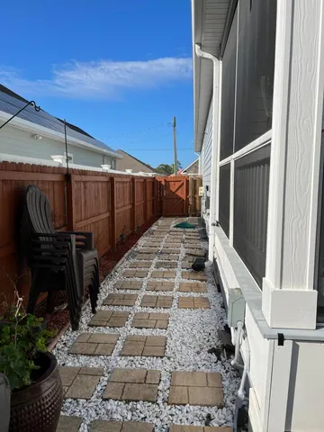 a large kitchen with kitchen island a stove a sink a refrigerator and a wooden floors