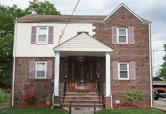 a front view of a house with glass windows