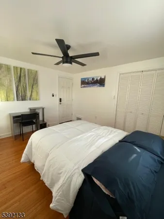 a bedroom with a bed and a table in it