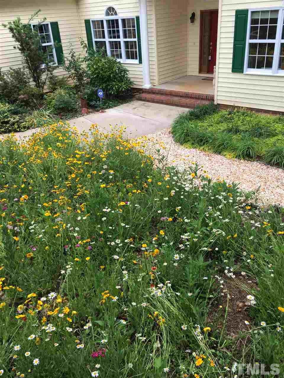 114 Bynum Ridge Road Pittsboro, NC 27312 - Photo 2 of 23 An inviting yard perfect for gardeners.