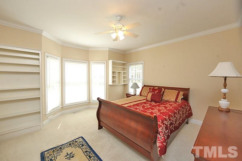 114 Bynum Ridge Road Pittsboro, NC 27312 - Photo 10 of 23 This main floor flex room can serve many purposes with its built-in shelving. Here it is staged as a bedroom.