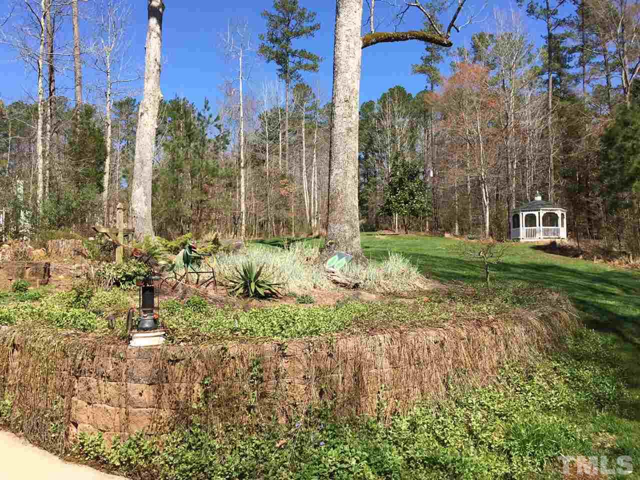 114 Bynum Ridge Road Pittsboro, NC 27312 - Photo 20 of 23 The front yard has a screened gazebo and parallels the newly paved driveway that should be maintenance-free for years to come.