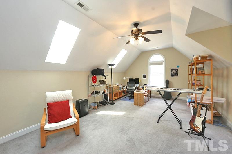 114 Bynum Ridge Road Pittsboro, NC 27312 - Photo 21 of 23 Is it a bedroom or a bonus room? It's both, of course. The only room on the second floor features a large living area with an adjacent full bath and walk-in closet. It can serve as a guest suite or media room.