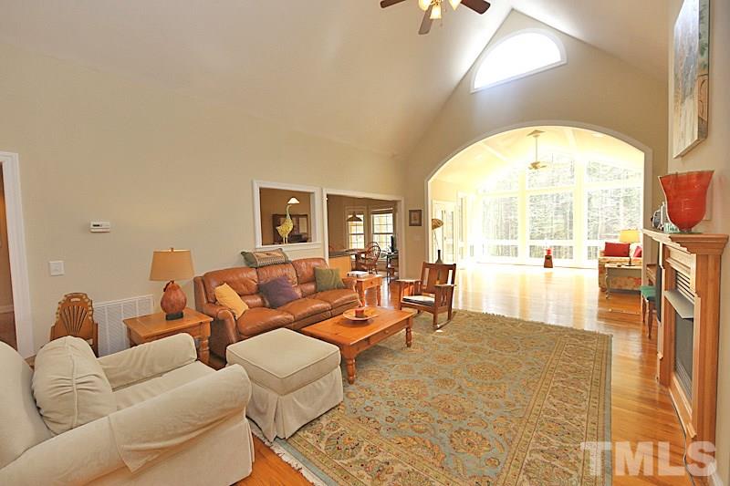 114 Bynum Ridge Road Pittsboro, NC 27312 - Photo 23 of 23 The open floor plan from entry hall to family room to sun room is perfect for entertaining.