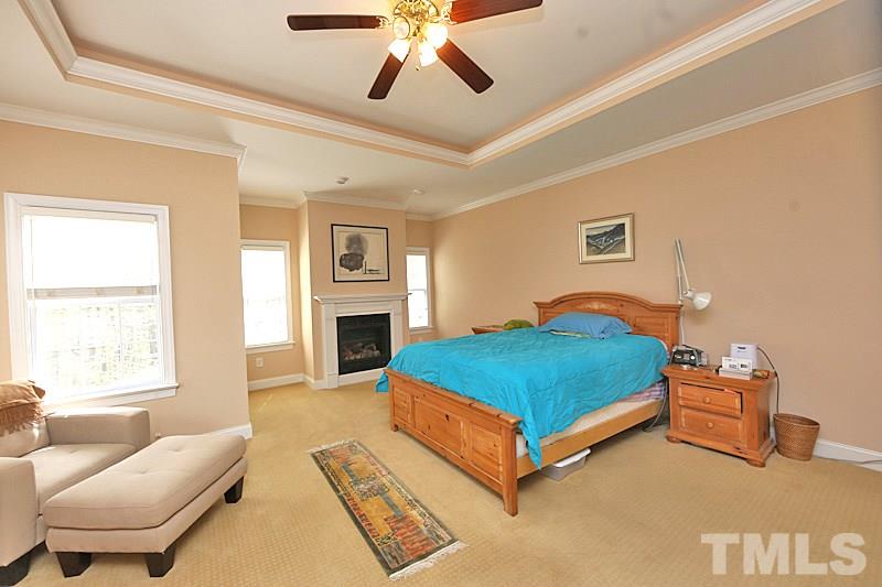 114 Bynum Ridge Road Pittsboro, NC 27312 - Photo 6 of 23 The master bedroom is an oasis of privacy, complete with gas log fireplace and sitting area for quiet contemplation.