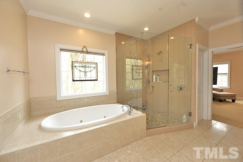 114 Bynum Ridge Road Pittsboro, NC 27312 - Photo 7 of 23 The master bath features a large garden tub and custom-designed shower.