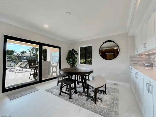 a view of a dining room and kitchen