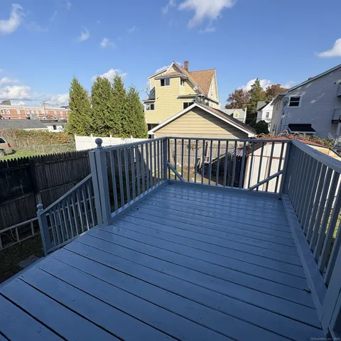 a view of a wooden deck with a chairs