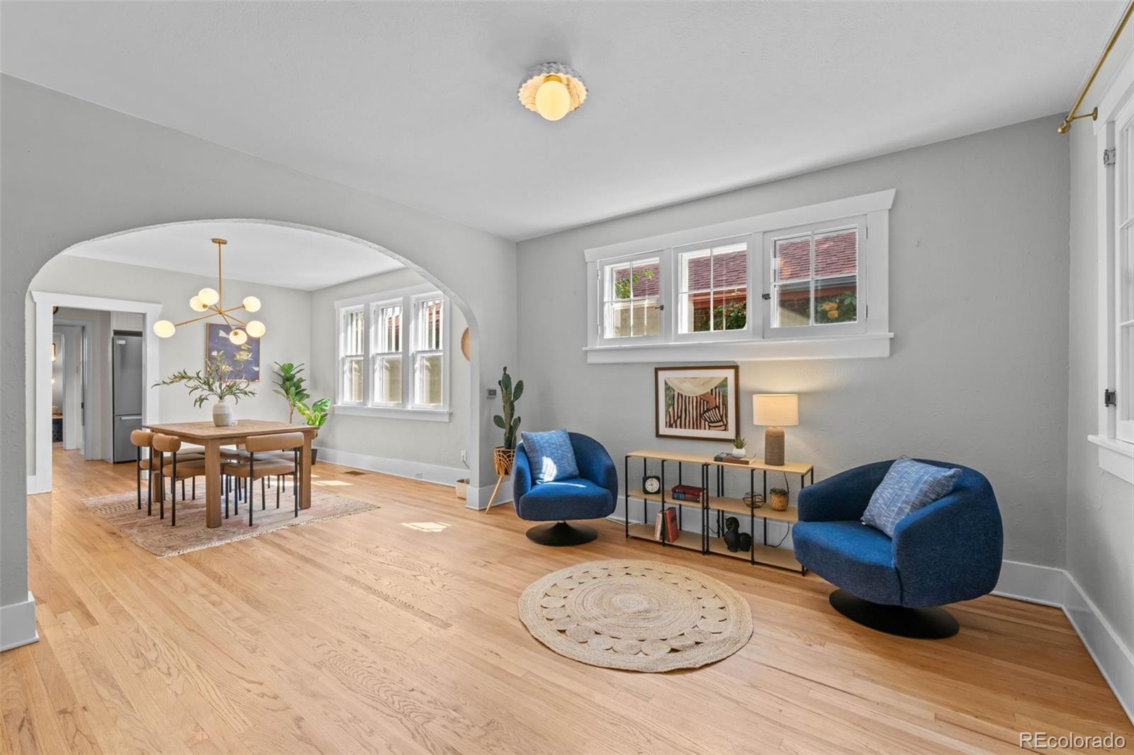 2314 Grape Street Denver, CO 80207 - Photo 12 of 49 a living room with furniture and a wooden floor