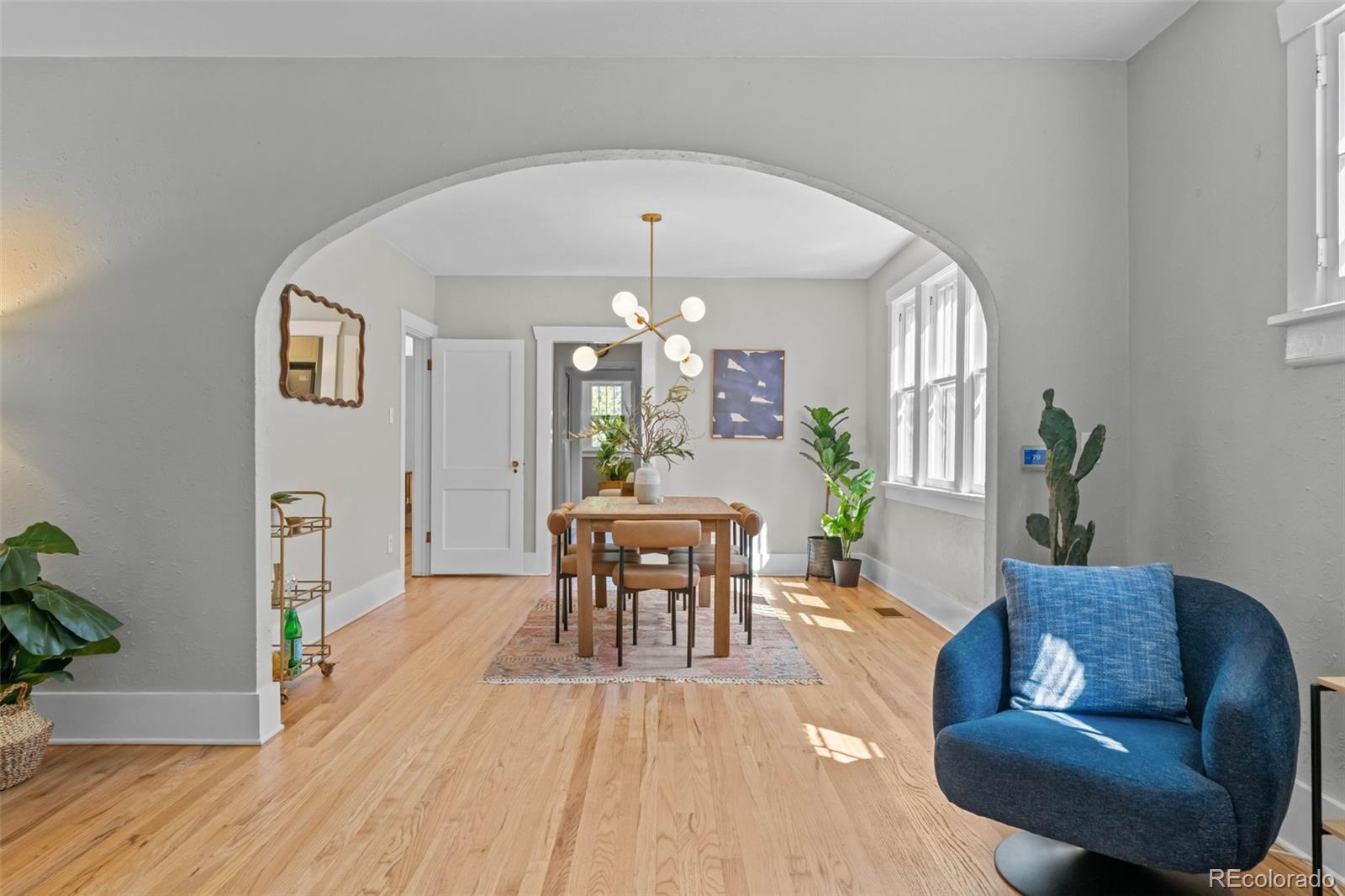 2314 Grape Street Denver, CO 80207 - Photo 13 of 49 a living room with furniture and a wooden floor