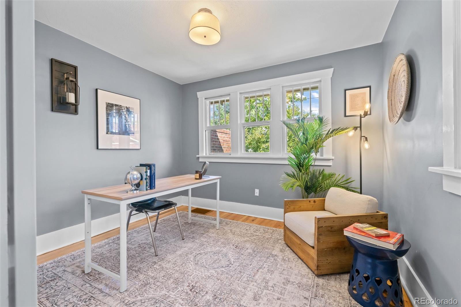 2314 Grape Street Denver, CO 80207 - Photo 20 of 49 a workspace with furniture and a window