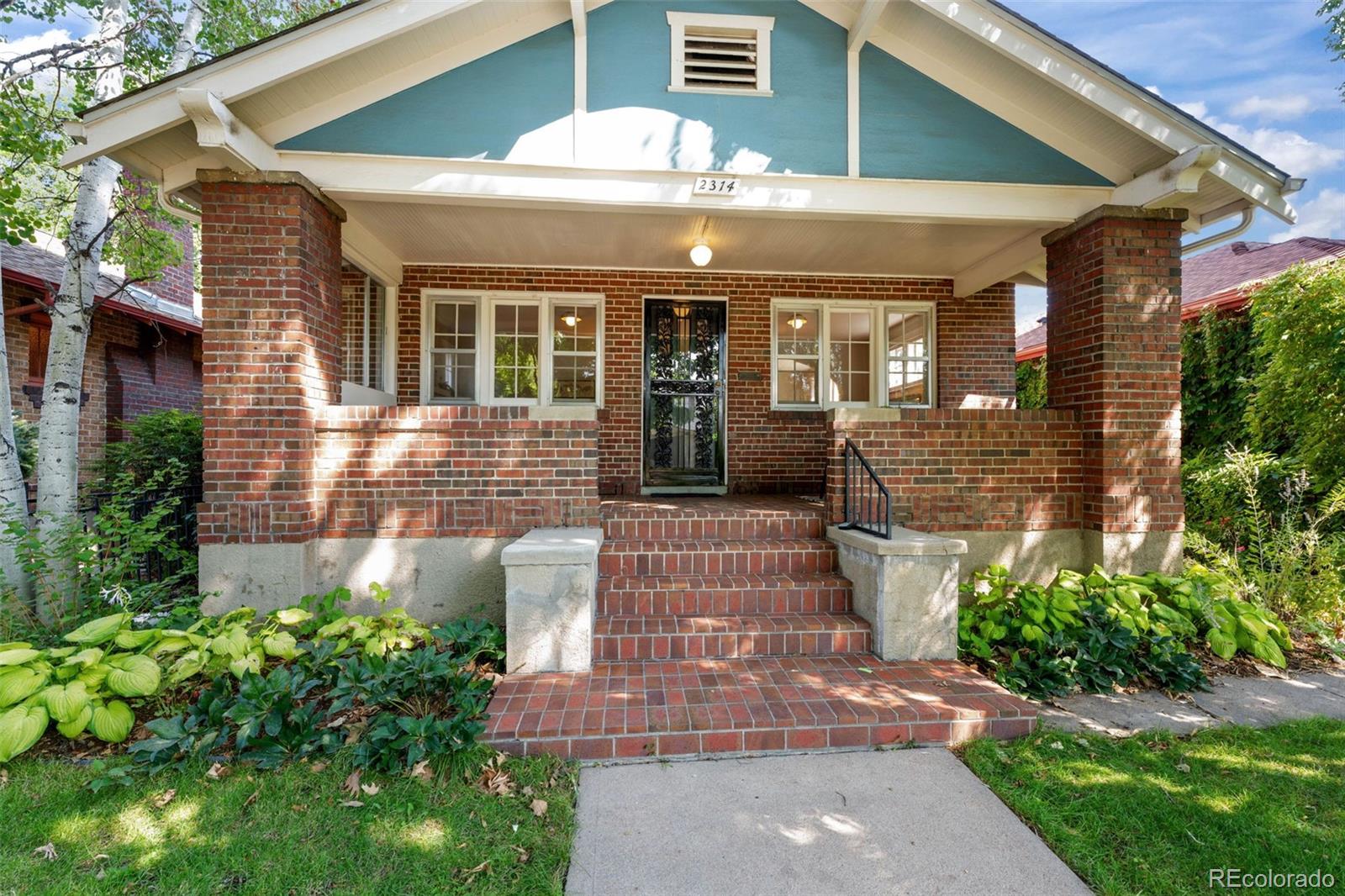2314 Grape Street Denver, CO 80207 - Photo 2 of 49 a front view of a house