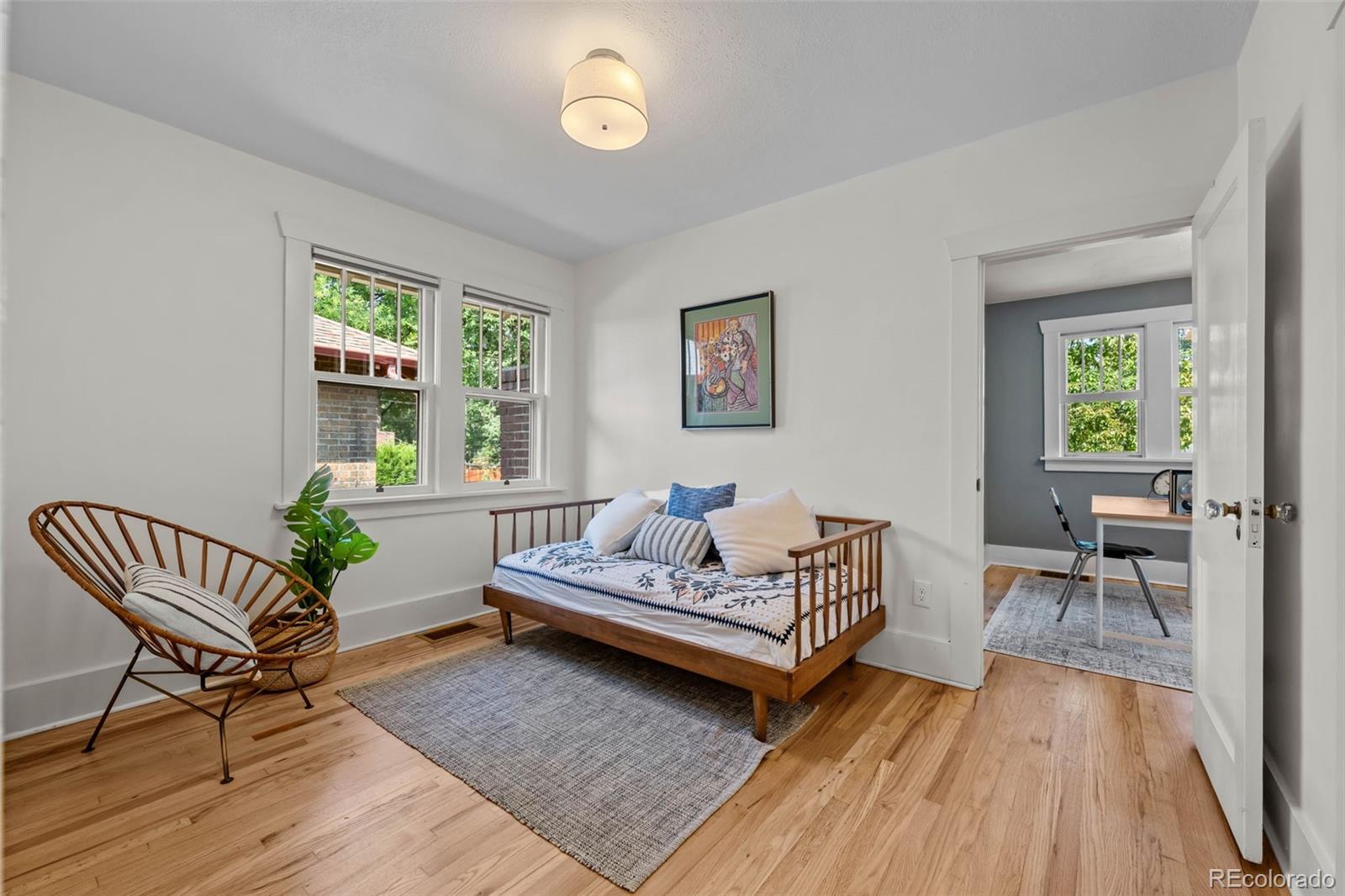 2314 Grape Street Denver, CO 80207 - Photo 25 of 49 a living room with furniture and a wooden floor