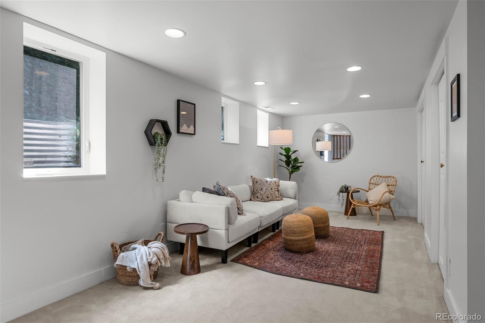 2314 Grape Street Denver, CO 80207 - Photo 26 of 49 a bedroom with furniture and a window