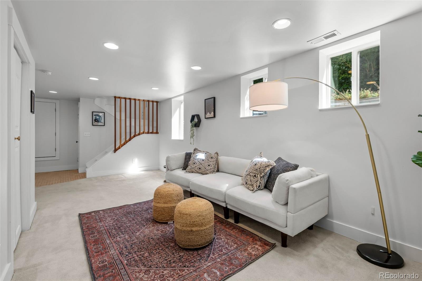 2314 Grape Street Denver, CO 80207 - Photo 28 of 49 a living room with furniture and a rug
