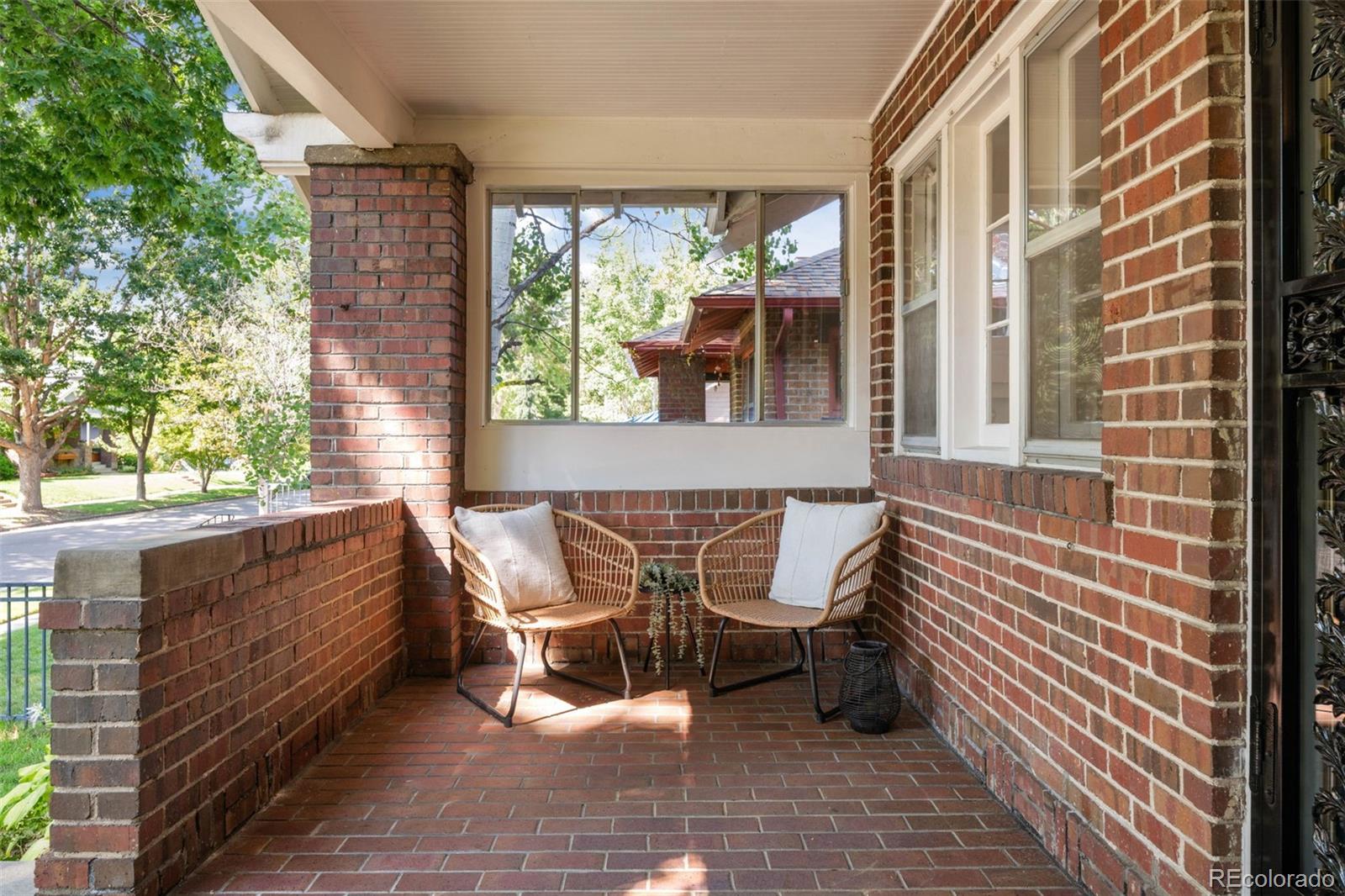 2314 Grape Street Denver, CO 80207 - Photo 5 of 49 a balcony with table and chairs