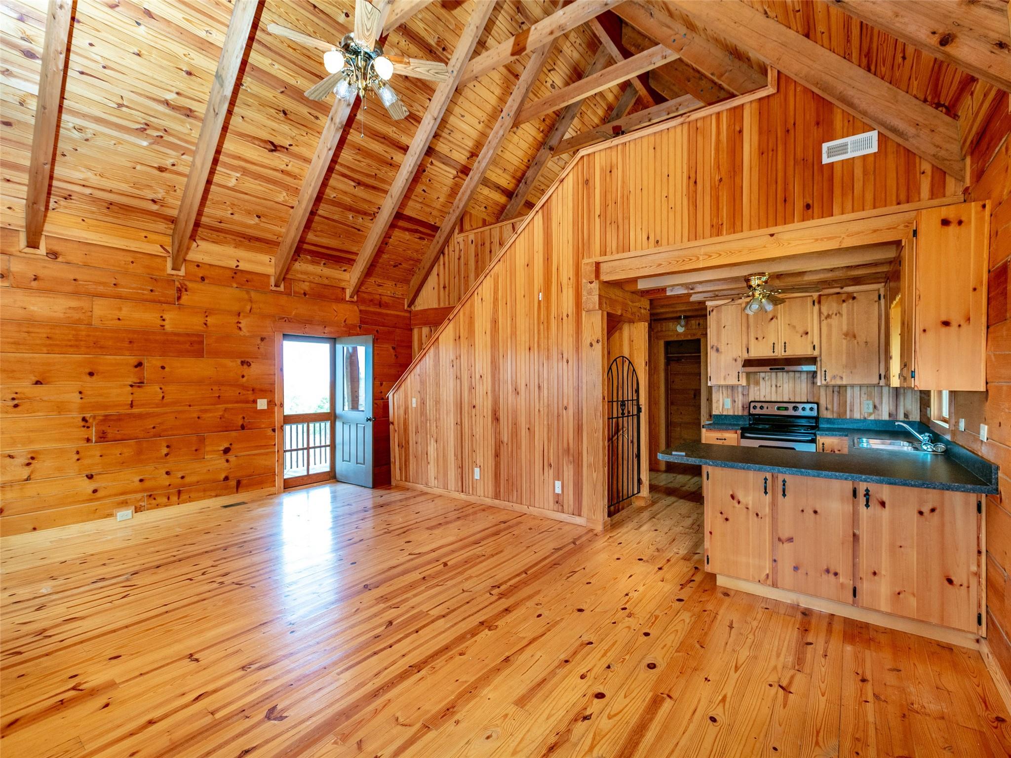 527 Laughter Road Mill Spring, NC 28756 - Photo 3 of 14 a view of a porch with wooden floor and a sink