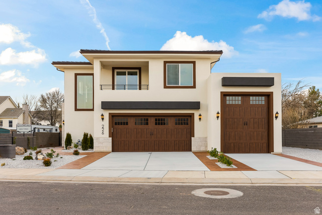 226 East 1100 North Hurricane, UT 84737 - Photo 11 of 49 Contemporary home featuring stucco siding, driveway, and a garage