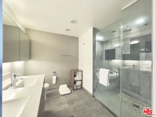 a bathroom with a sink a toilet and bathtub