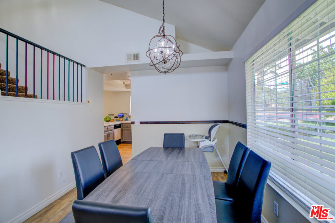 19281 Foxtail Lane Riverside, CA 92508 - Photo 12 of 53 a view of a dining room with furniture window and wooden floor