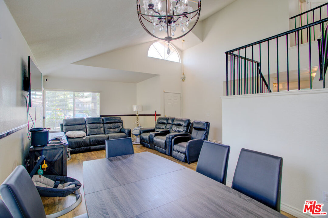 19281 Foxtail Lane Riverside, CA 92508 - Photo 14 of 53 a living room with furniture or couch and a dining table with wooden floor