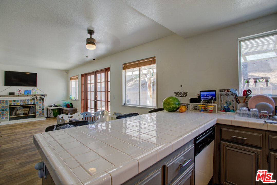 19281 Foxtail Lane Riverside, CA 92508 - Photo 18 of 53 a kitchen with a stove a sink and a refrigerator