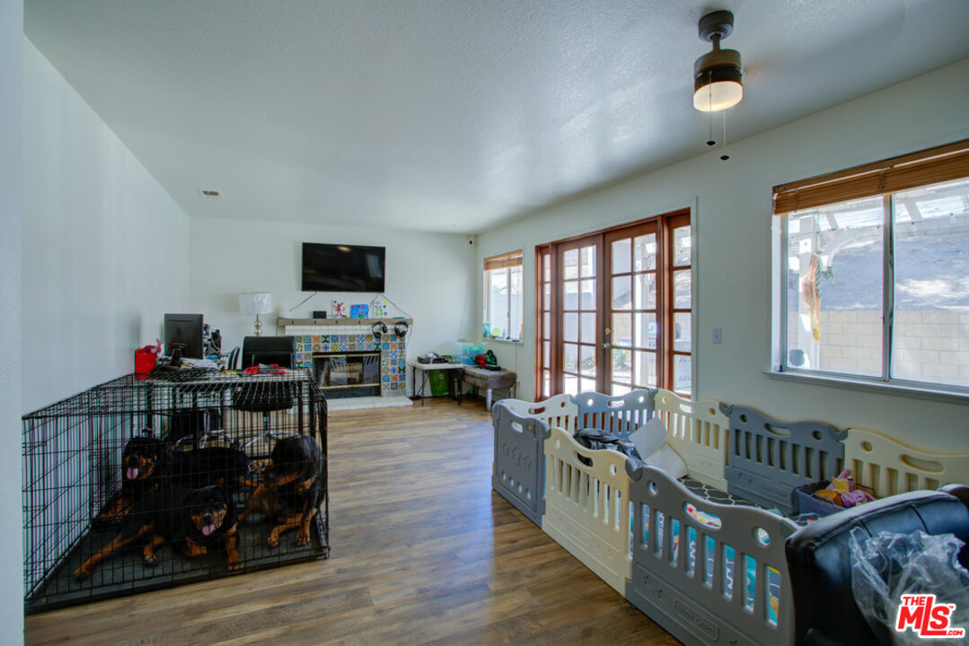 19281 Foxtail Lane Riverside, CA 92508 - Photo 20 of 53 a bedroom with furniture a window and a flat screen tv