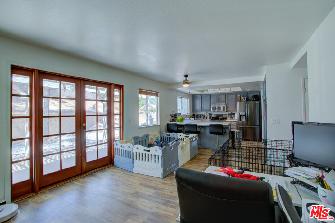 19281 Foxtail Lane Riverside, CA 92508 - Photo 21 of 53 a living room with furniture and a flat screen tv