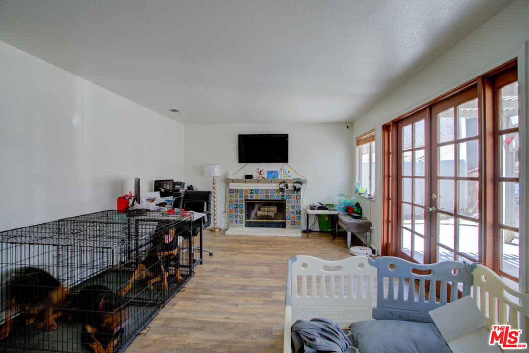 19281 Foxtail Lane Riverside, CA 92508 - Photo 25 of 53 a living room with furniture a fireplace and a flat screen tv