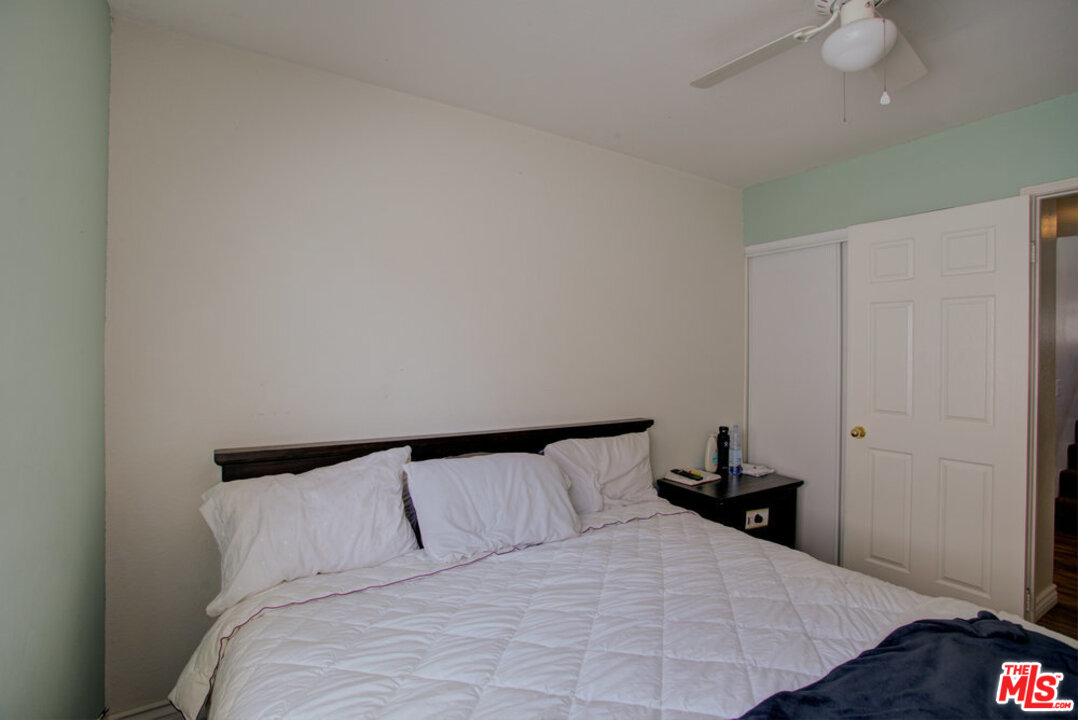 19281 Foxtail Lane Riverside, CA 92508 - Photo 28 of 53 a bedroom with a bed and a night stand