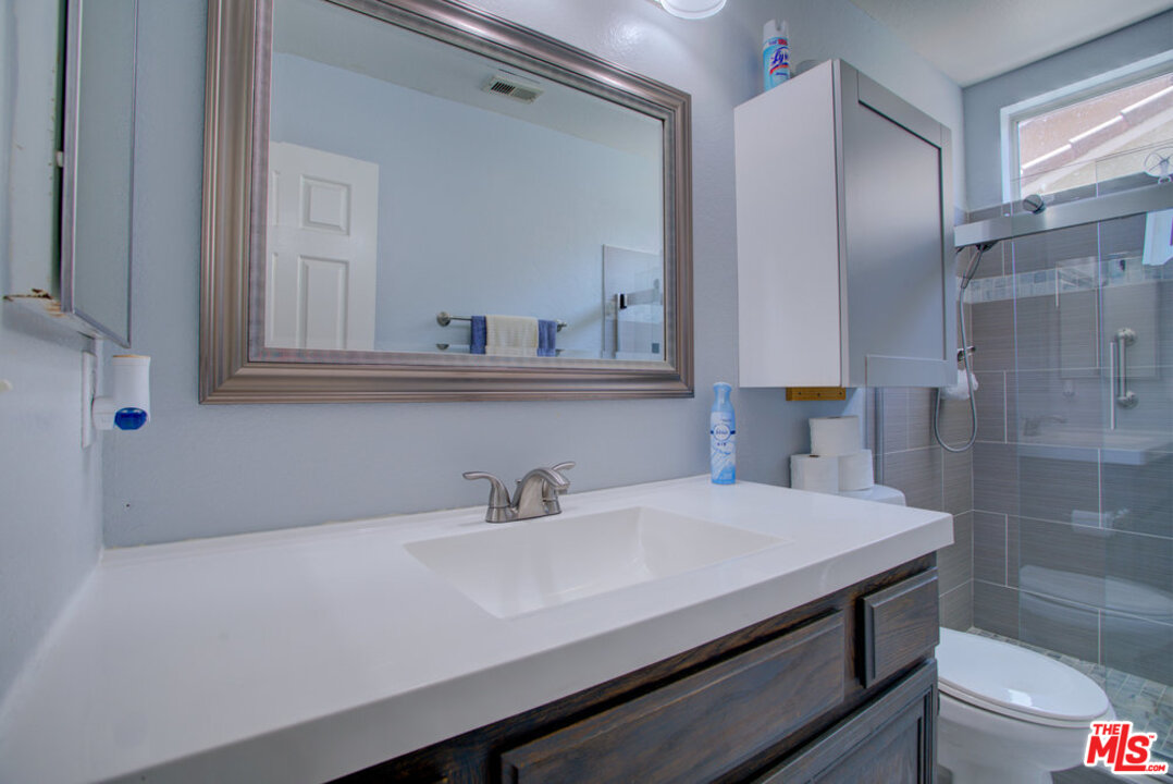 19281 Foxtail Lane Riverside, CA 92508 - Photo 31 of 53 a bathroom with a sink and a mirror