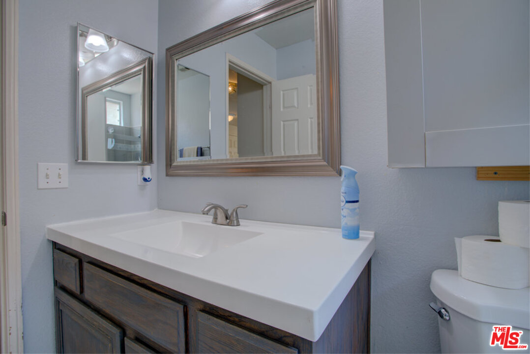 19281 Foxtail Lane Riverside, CA 92508 - Photo 32 of 53 a bathroom with a sink and a toilet