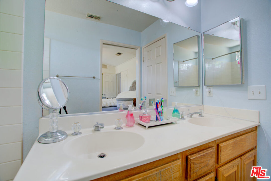 19281 Foxtail Lane Riverside, CA 92508 - Photo 37 of 53 a bathroom with a sink and a mirror