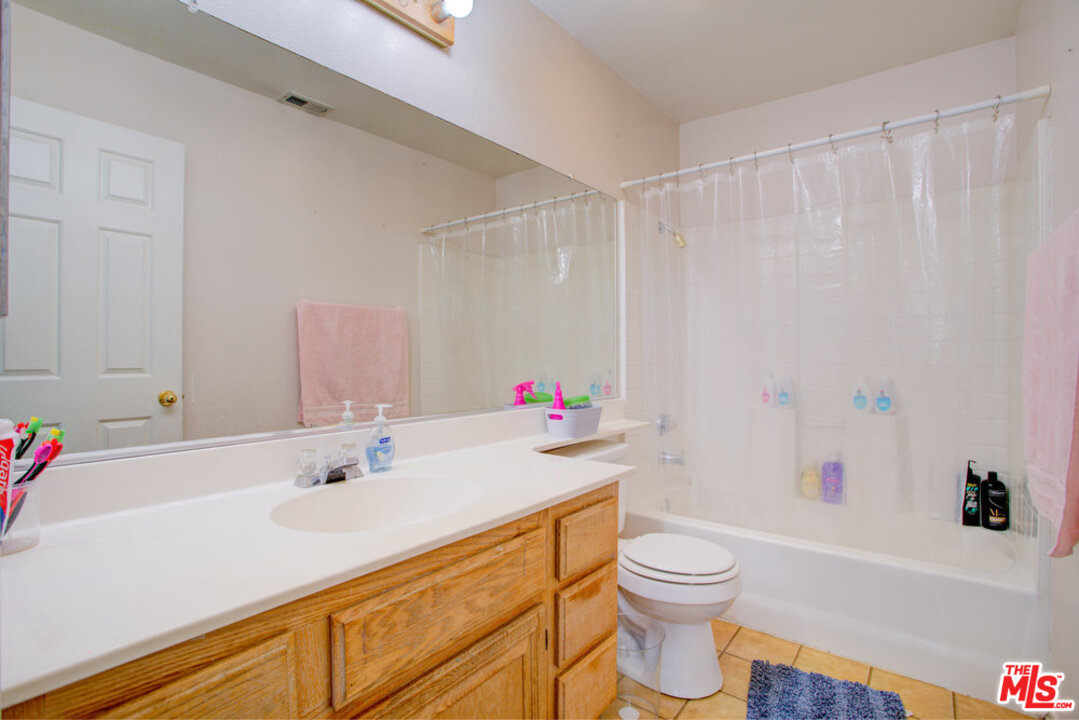 19281 Foxtail Lane Riverside, CA 92508 - Photo 38 of 53 a bathroom with a sink a toilet and a bathtub