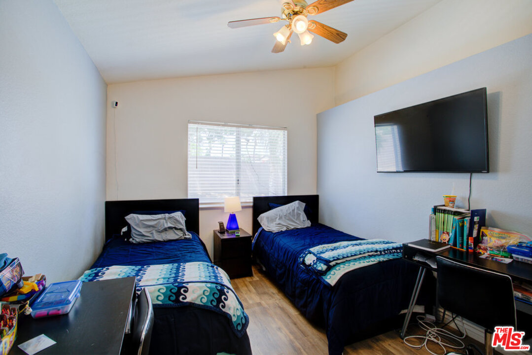 19281 Foxtail Lane Riverside, CA 92508 - Photo 44 of 53 a bedroom with a bed and a flat screen tv
