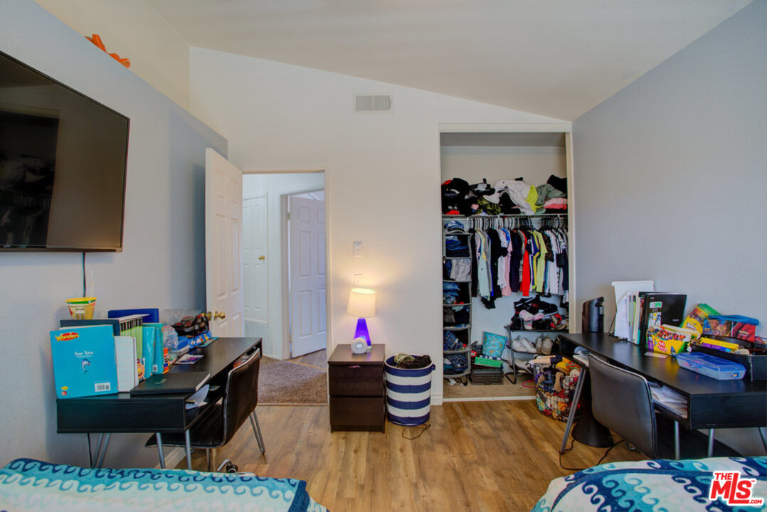 19281 Foxtail Lane Riverside, CA 92508 - Photo 45 of 53 a living room with furniture and a flat screen tv