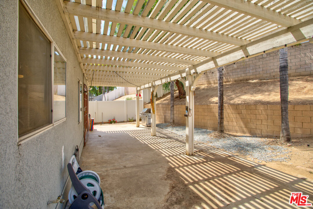19281 Foxtail Lane Riverside, CA 92508 - Photo 49 of 53 a view of a porch with a table and chairs