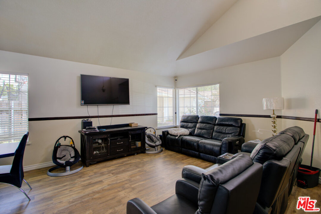 19281 Foxtail Lane Riverside, CA 92508 - Photo 7 of 53 a living room with furniture and a flat screen tv