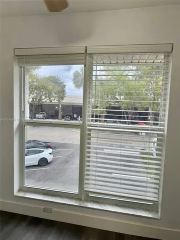 a view of a glass door and a window