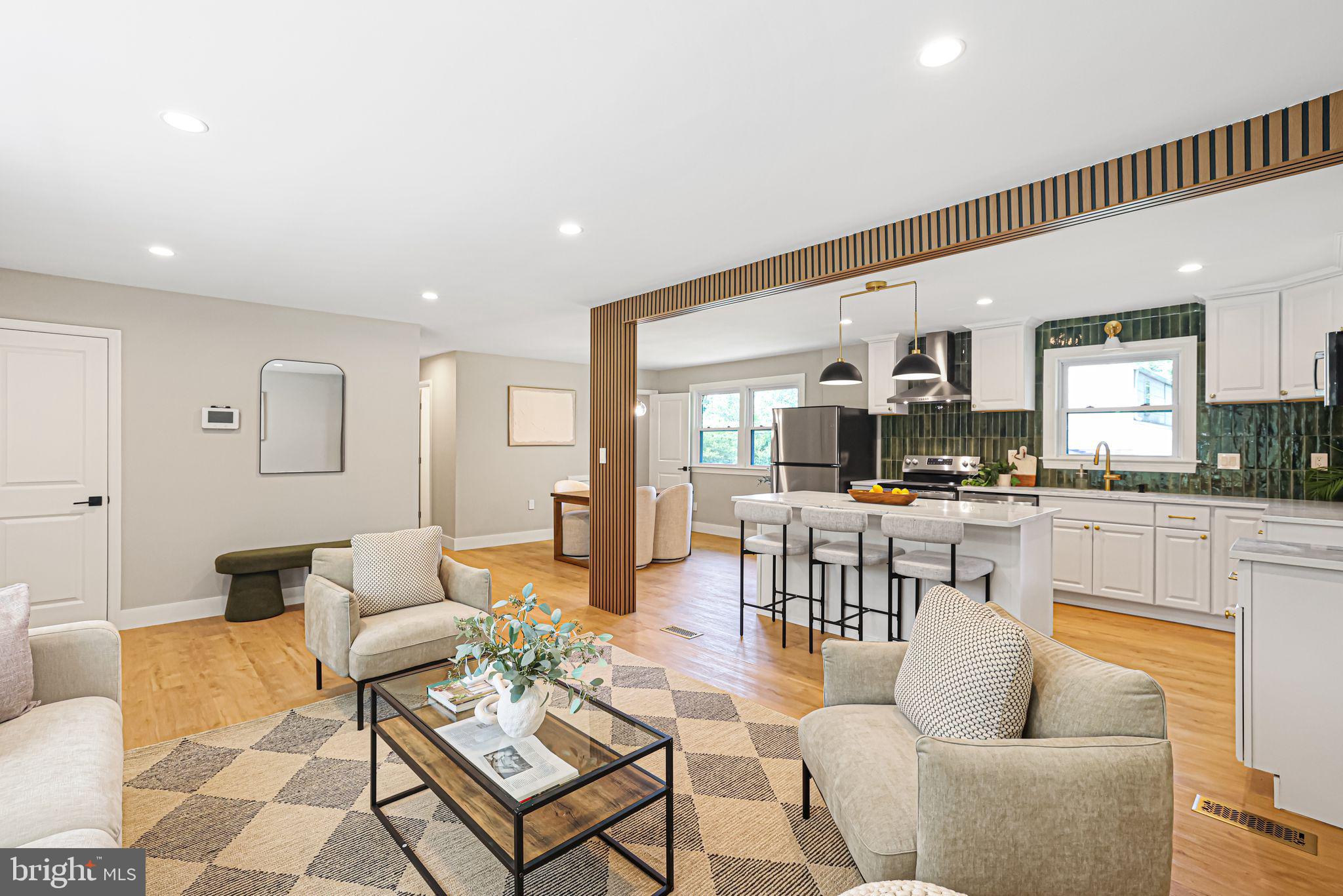 12300 La Plata Street Silver Spring, MD 20904 - Photo 11 of 45 a living room with furniture kitchen view and a wooden floor