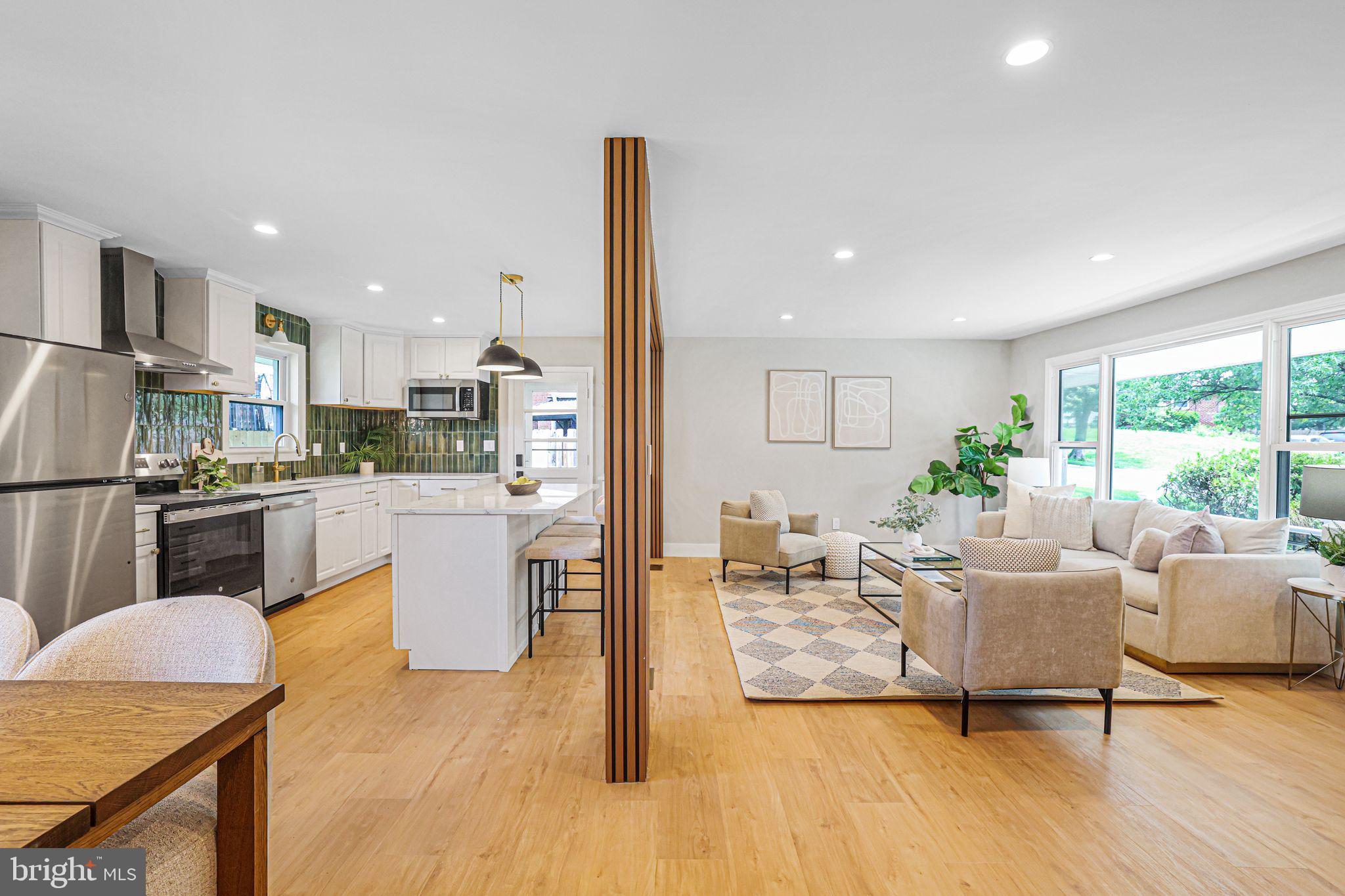 12300 La Plata Street Silver Spring, MD 20904 - Photo 15 of 45 a living room with kitchen island furniture and a kitchen view