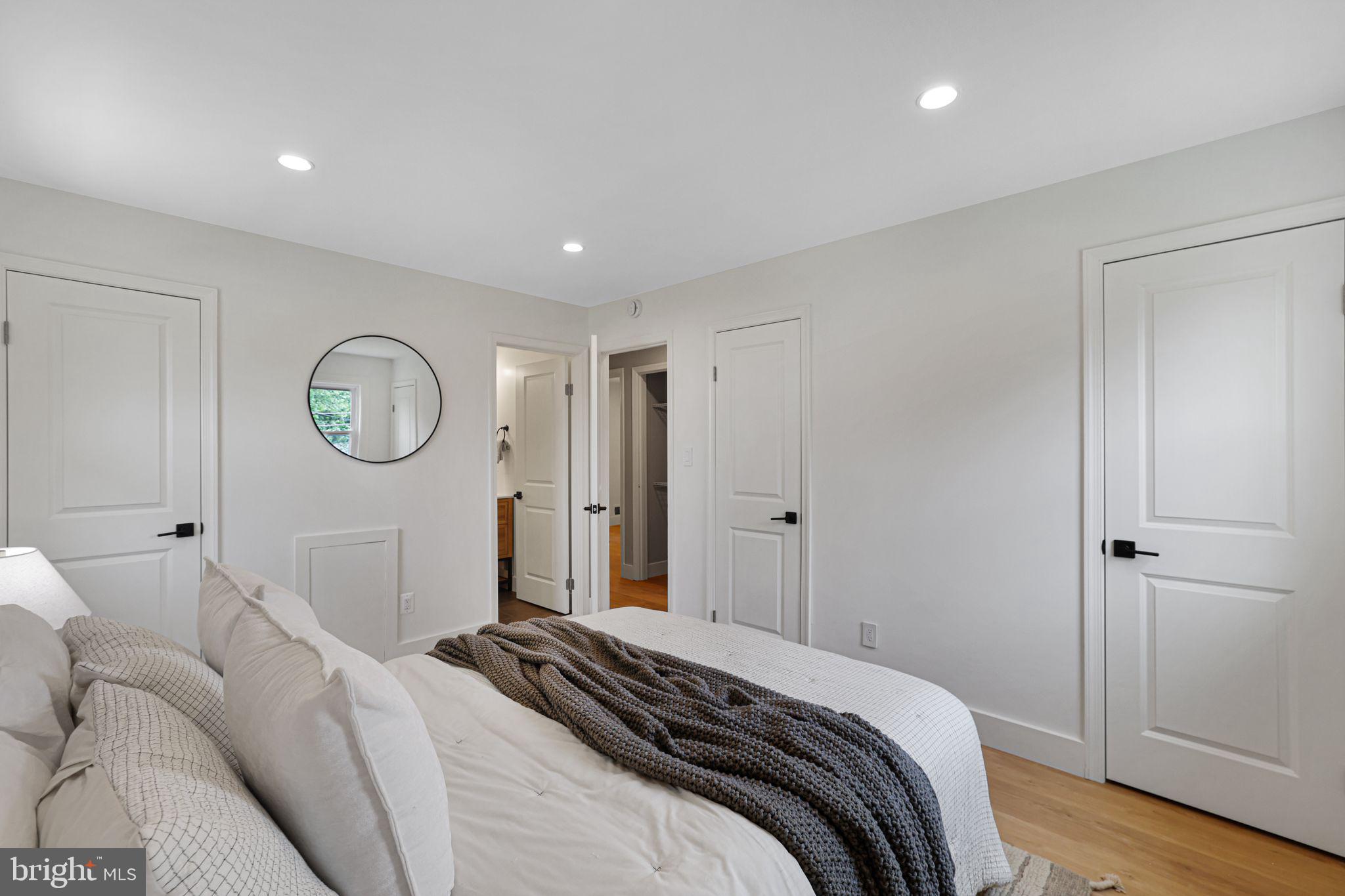 12300 La Plata Street Silver Spring, MD 20904 - Photo 19 of 45 a bedroom with a bed and a chandelier