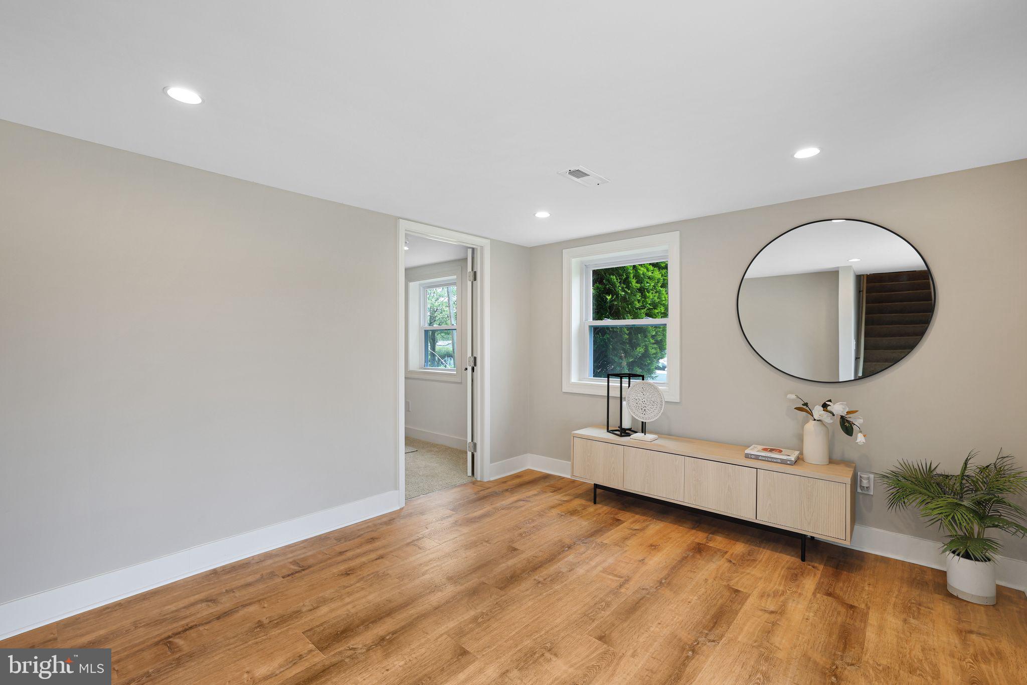 12300 La Plata Street Silver Spring, MD 20904 - Photo 27 of 45 a living room with furniture and a large mirror
