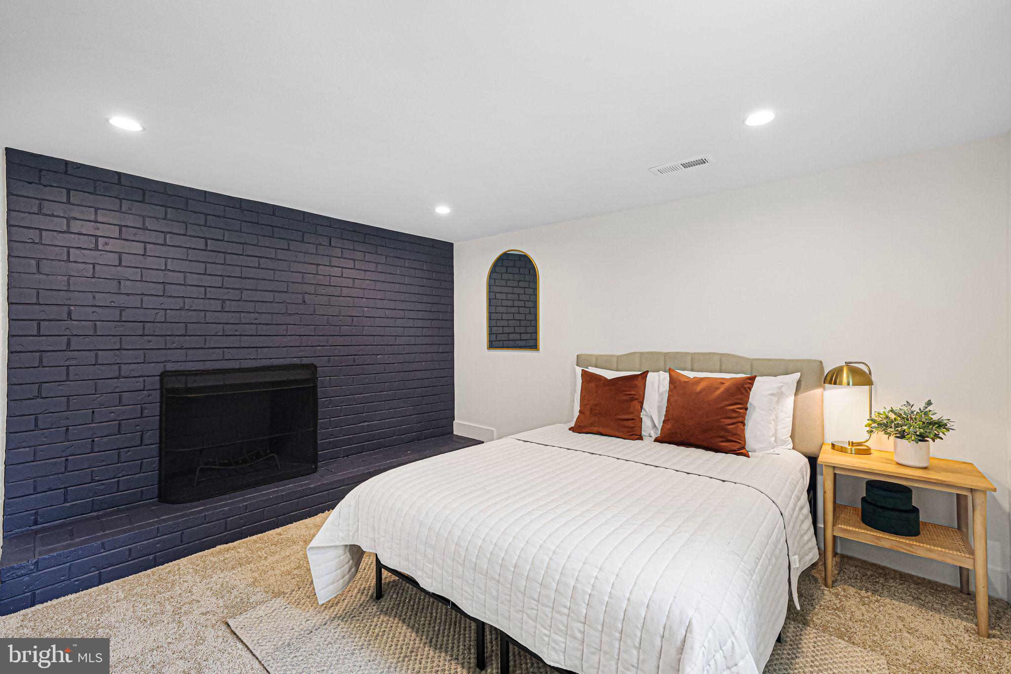 12300 La Plata Street Silver Spring, MD 20904 - Photo 29 of 45 a bedroom with a bed and a fireplace