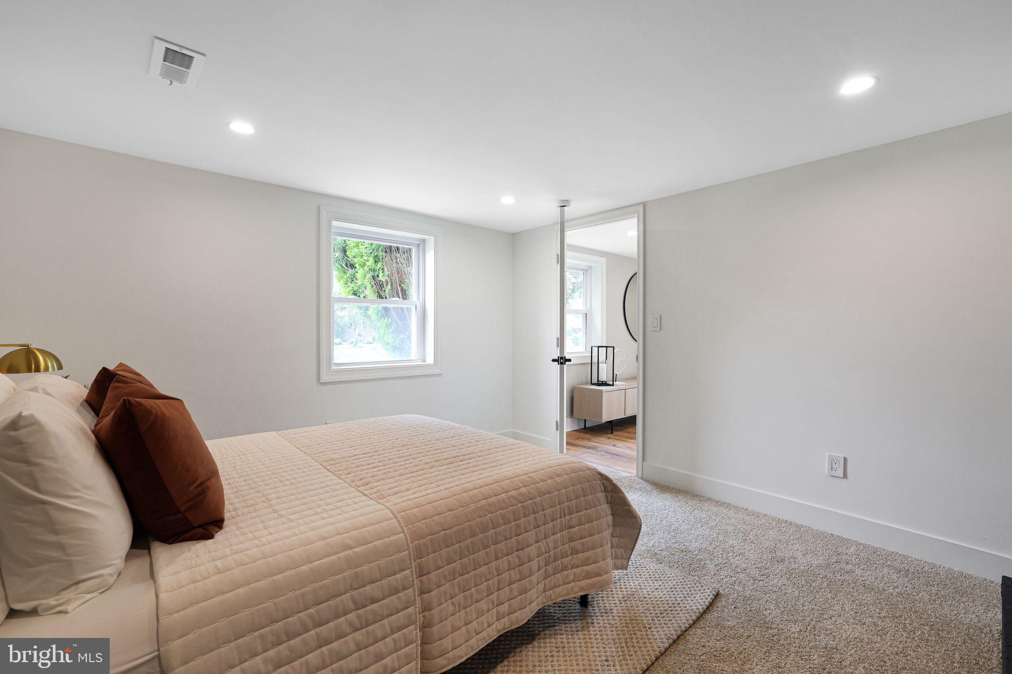 12300 La Plata Street Silver Spring, MD 20904 - Photo 30 of 45 a bedroom with a bed and a window