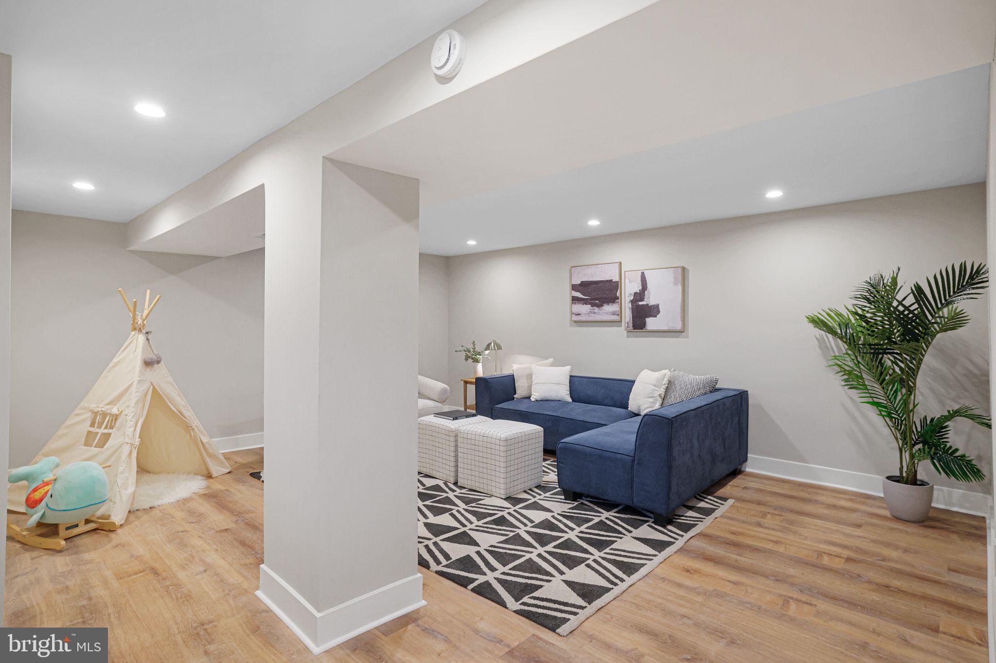 12300 La Plata Street Silver Spring, MD 20904 - Photo 35 of 45 a living room with furniture and a potted plant