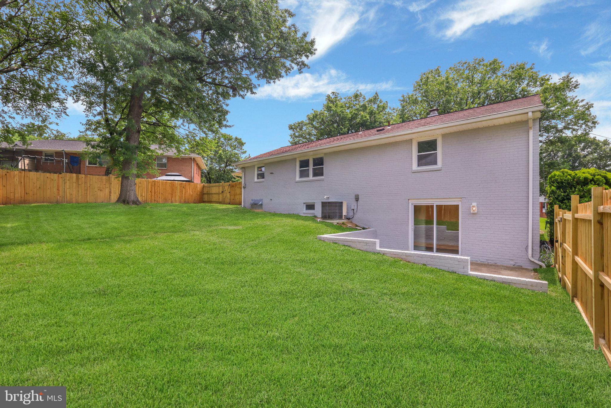 12300 La Plata Street Silver Spring, MD 20904 - Photo 40 of 45 a front view of house with yard and trees in the background