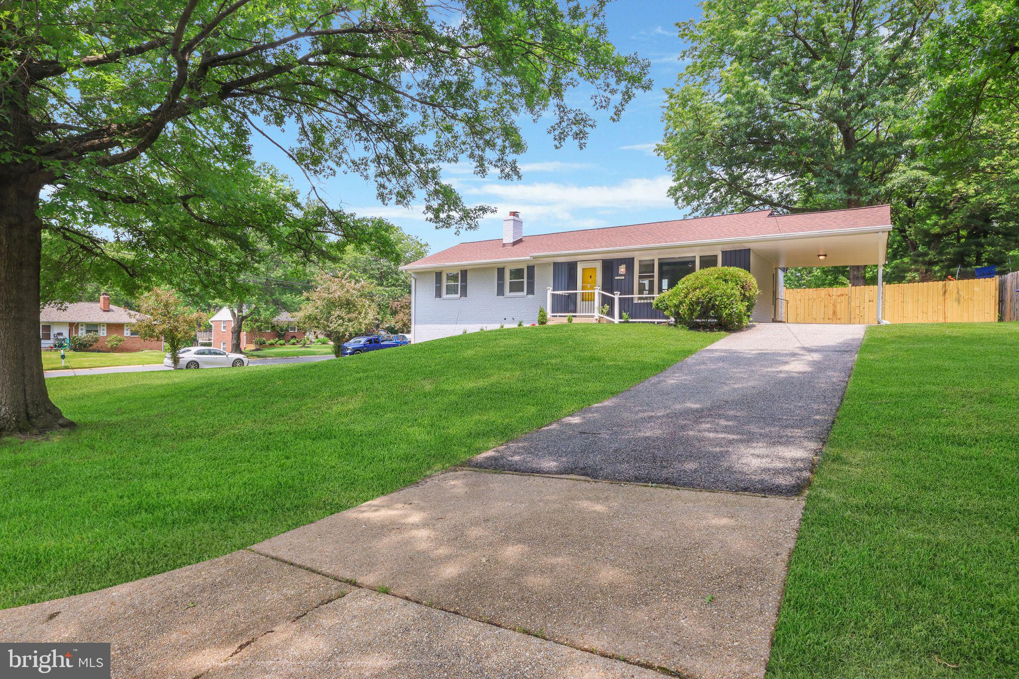 12300 La Plata Street Silver Spring, MD 20904 - Photo 42 of 45 a view of a house next to a big yard and large trees