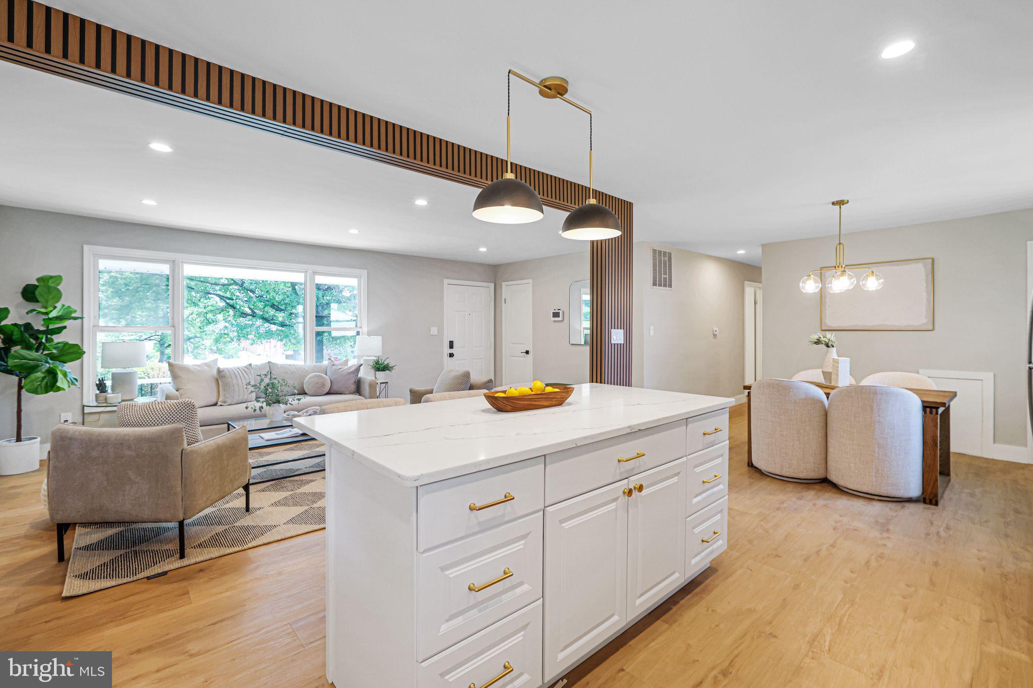 12300 La Plata Street Silver Spring, MD 20904 - Photo 6 of 45 a living room with kitchen island furniture and a wooden floor